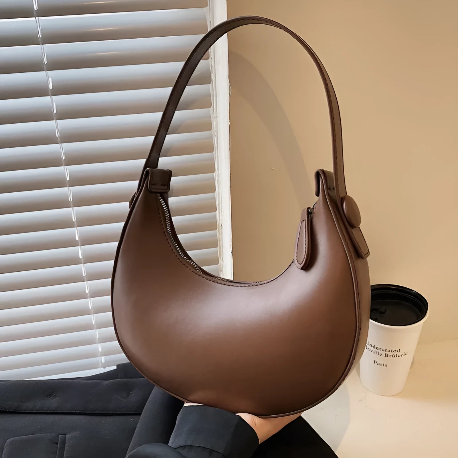 Retro-style women's dumpling-shaped shoulder bag in PU, shown in one of four colours.
