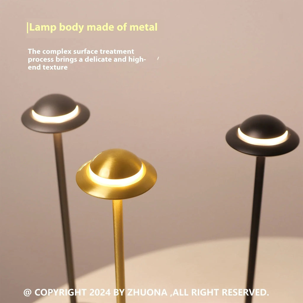 UFO-shaped rechargeable desk lamp with metal base and touch dimming in black, gold or grey