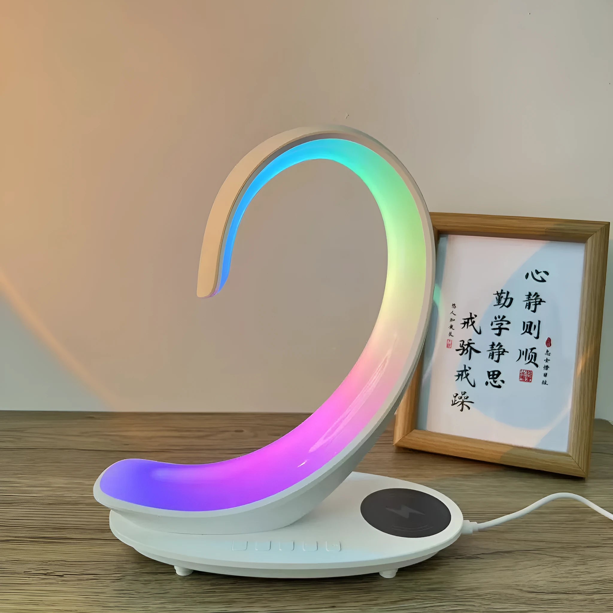 White swan-shaped desktop wireless charger with Bluetooth speaker and colourful LED atmosphere lighting