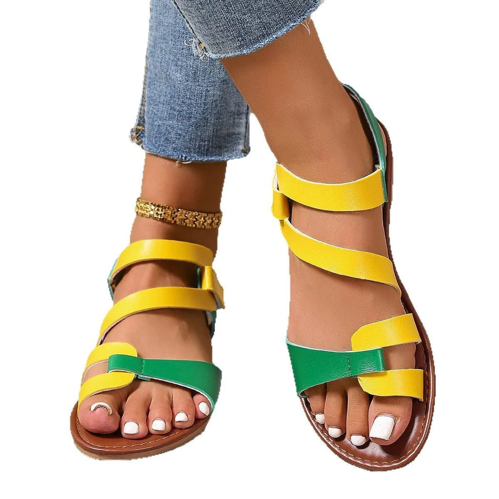 Women's flat sandals with adjustable Velcro straps in black, brown, or colourful designs