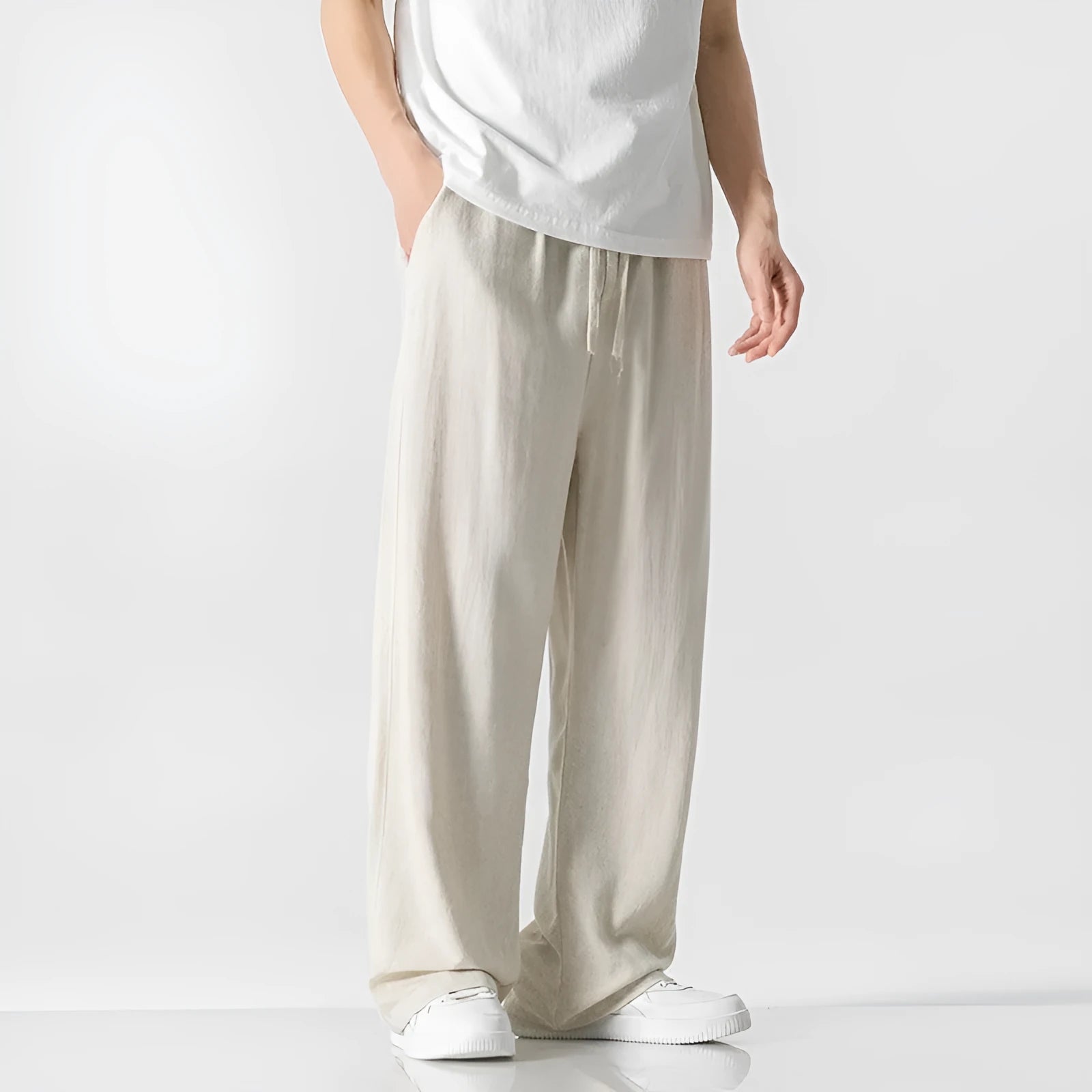 Men's cropped linen trousers in bamboo fibre with a loose straight-leg fit and drawstring waist.