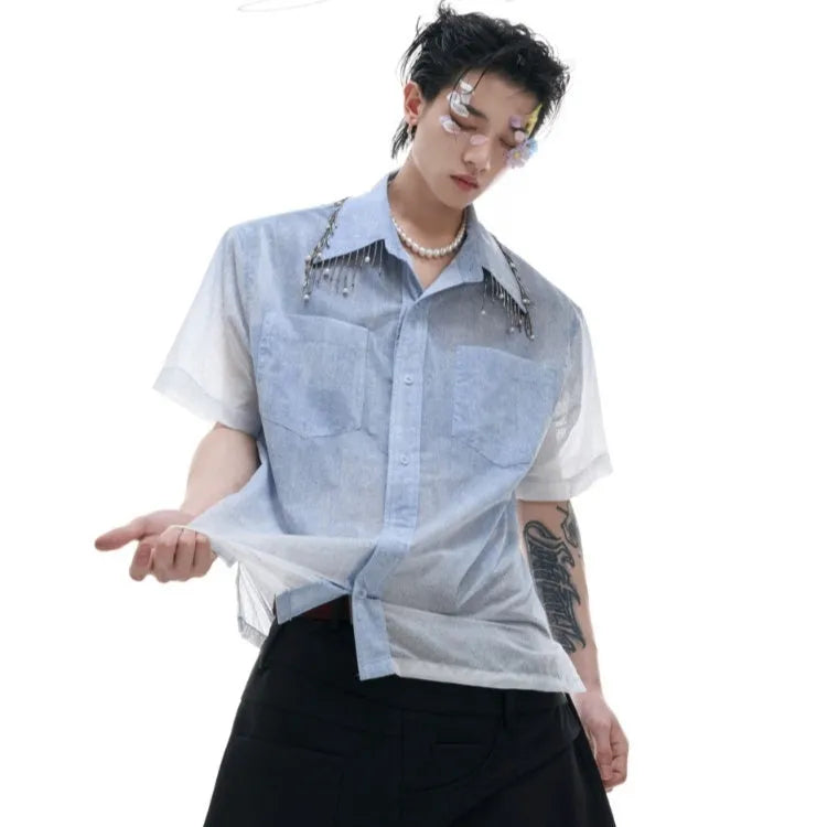 A loose-fit blue men's short sleeve shirt with a white gradient fade.