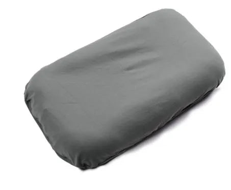 Beige portable baby nest crib for newborns measuring 75cm by 45cm on a neutral background.