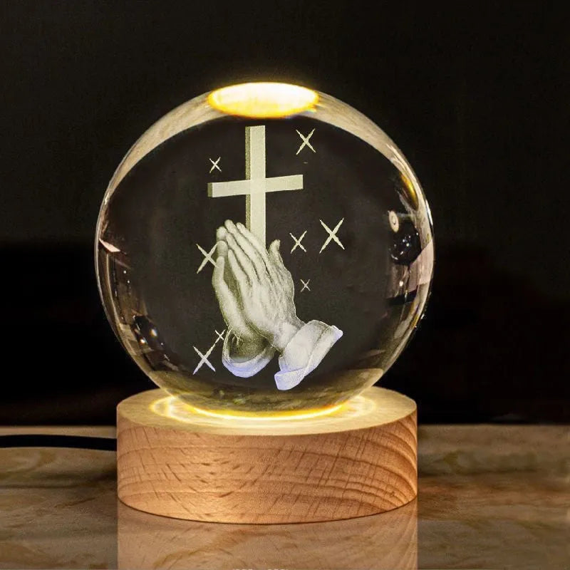 White crystal cross ornament with 6cm ball on wooden warm light base