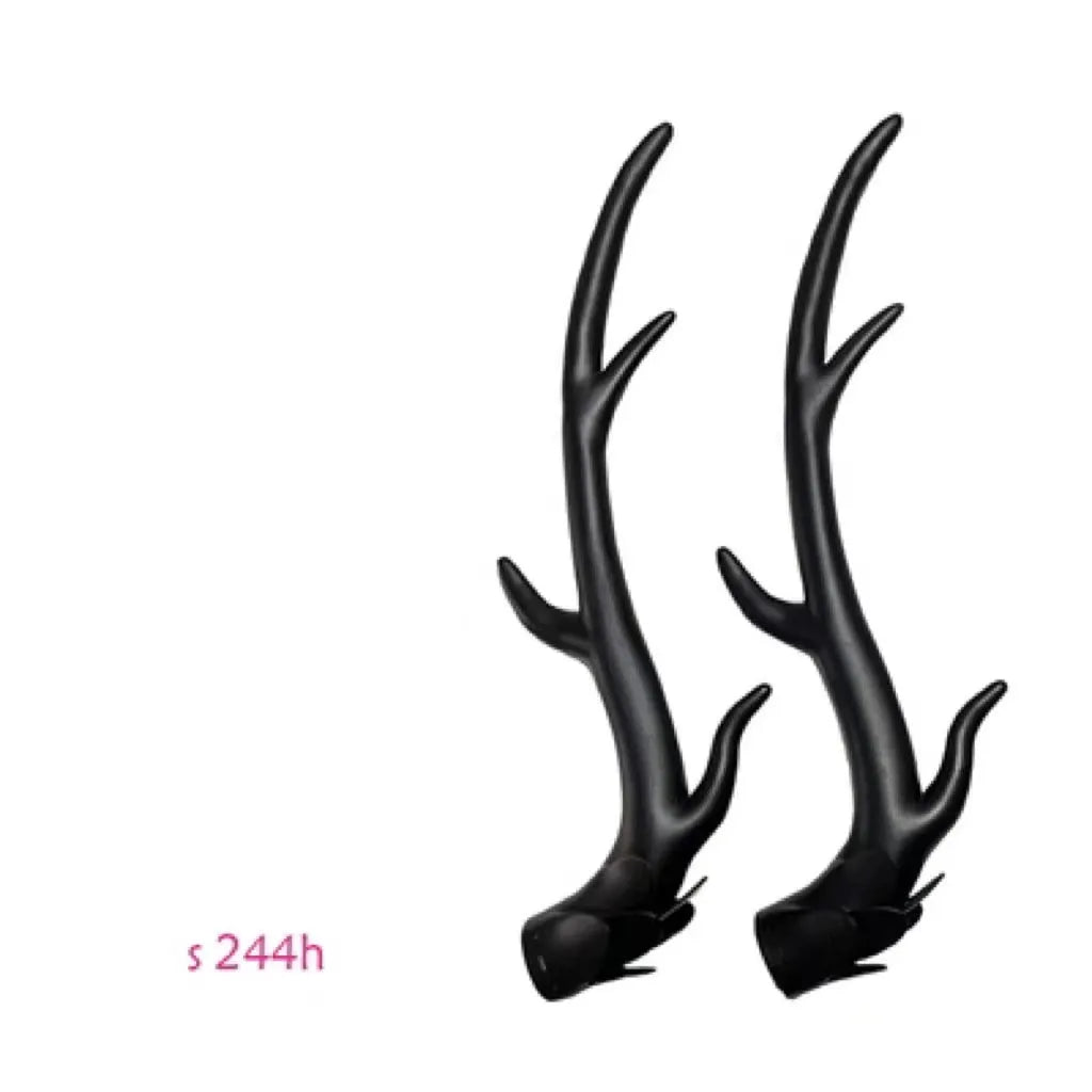 A pair of detailed black resin dragon horn decorations for customising motorcycle and scooter helmets.