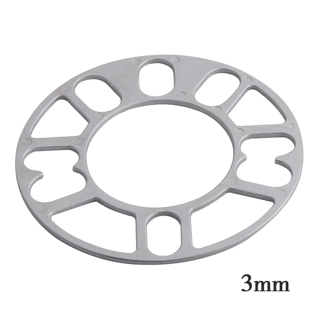 A single, circular metal automotive wheel hub spacer gasket for modifying wheel offset and brake clearance.