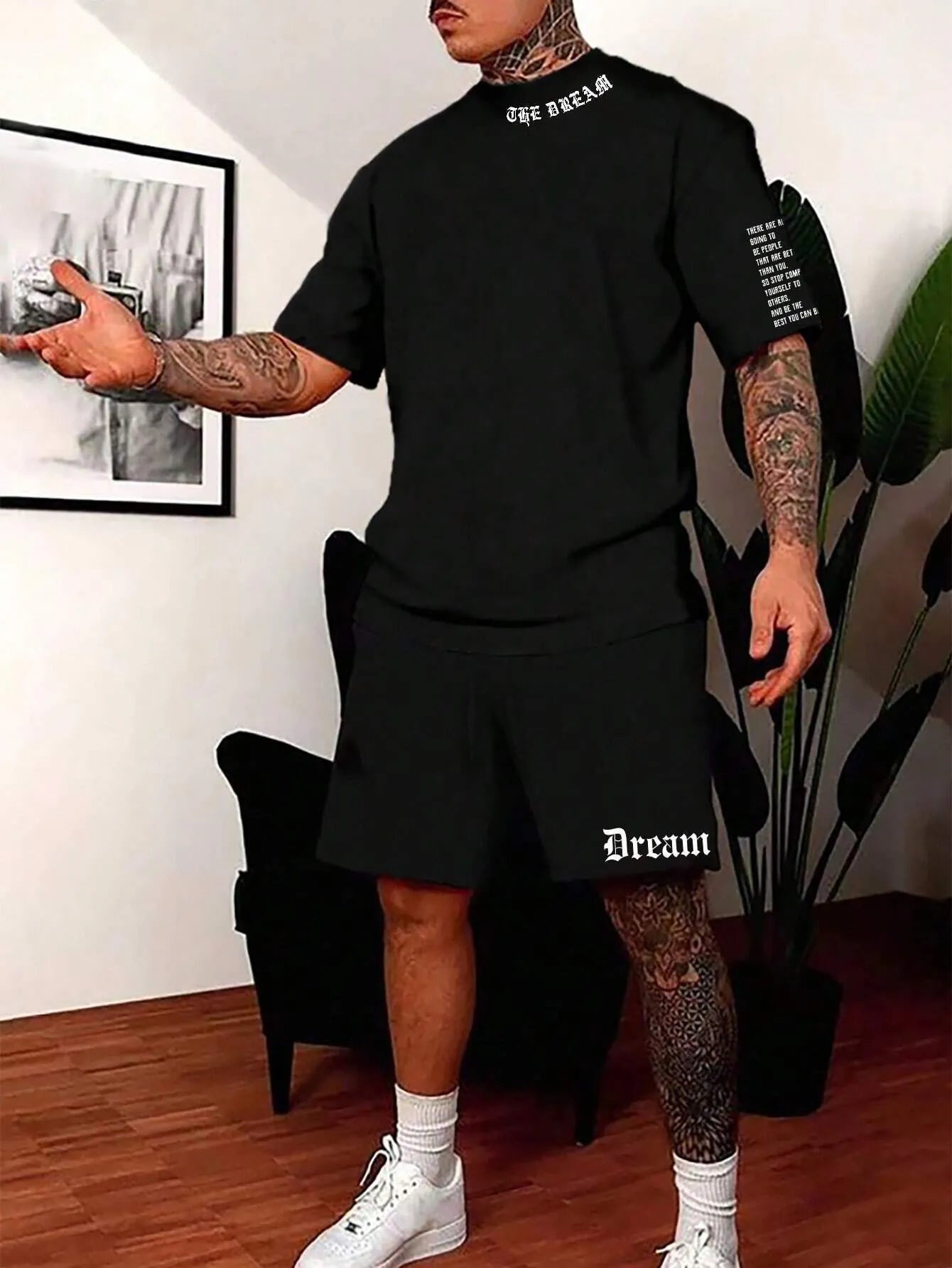 Men's grey sports short sleeve top and matching shorts set on hanger