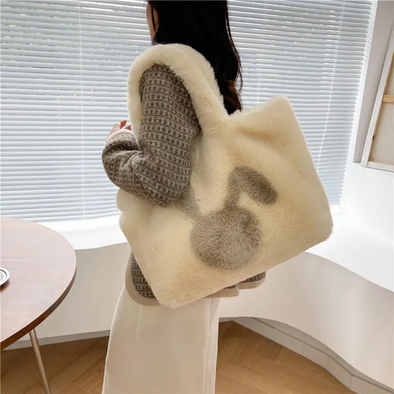 Cute cartoon rabbit ears plush shoulder tote bag in a solid colour.