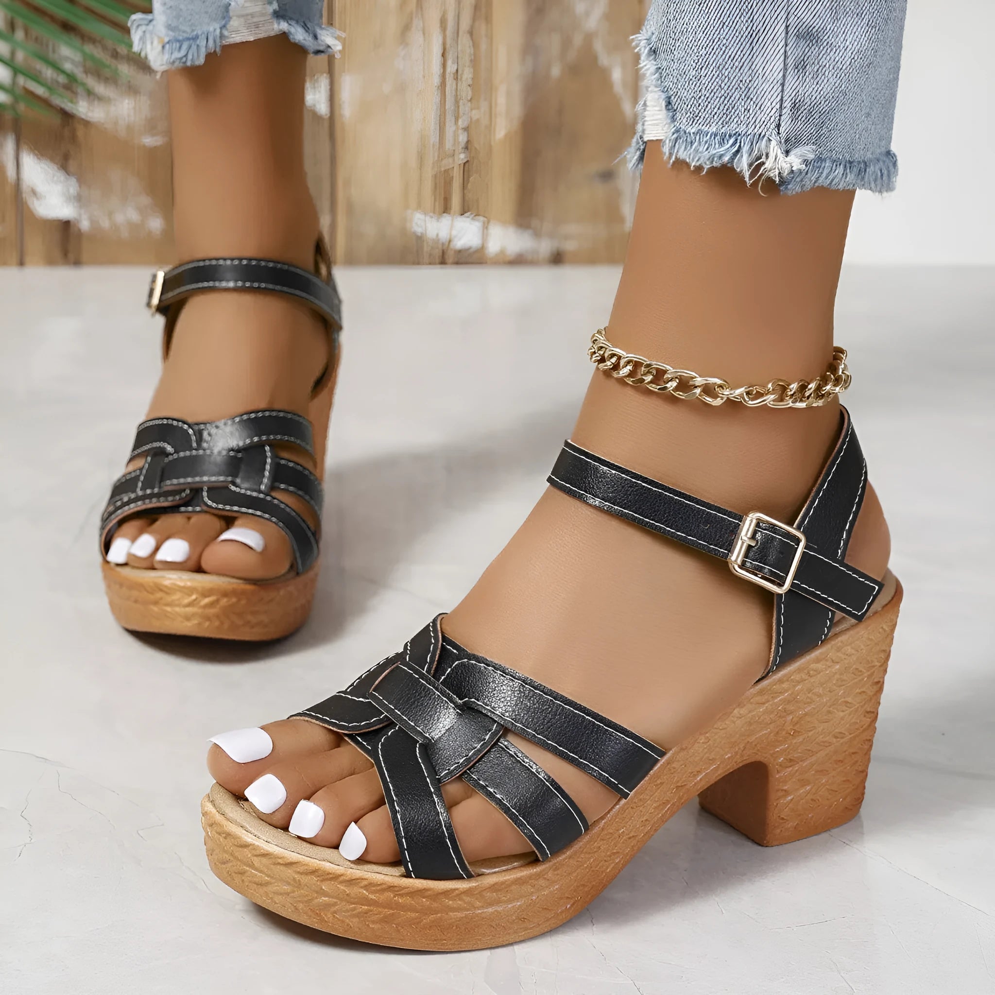 Plus size women's black peep toe sandals with a chunky heel and buckle ankle strap
