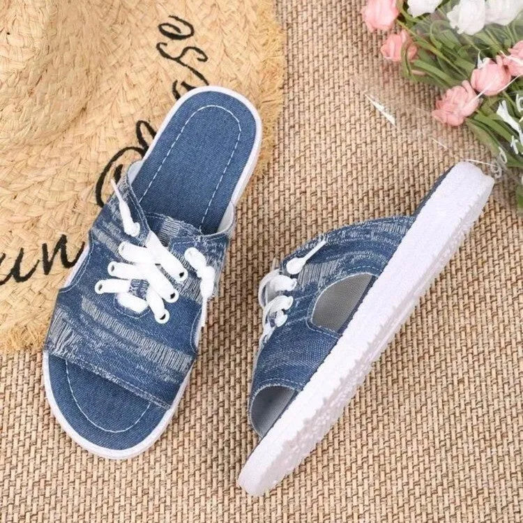 Blue canvas Roman-style slippers for women with a rubber sole.