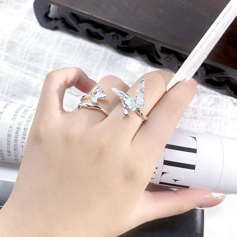 Adjustable copper fashion ring with modelled insect motif and metallic oil-finished surface.