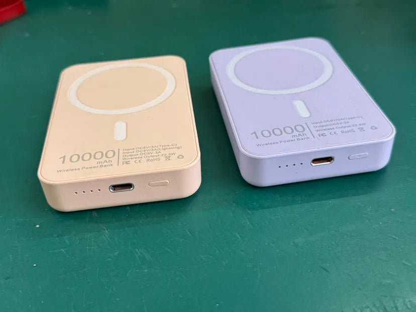 Magnetic wireless charging power bank in white with creative foot design showing charging surface