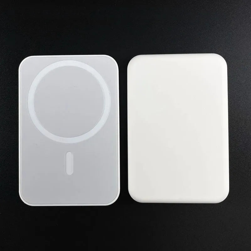 Magnetic wireless charging power bank in white with creative foot design showing charging surface