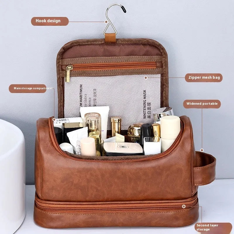 Leather travel toiletry bag in brown with hook, showing main compartment and portable design