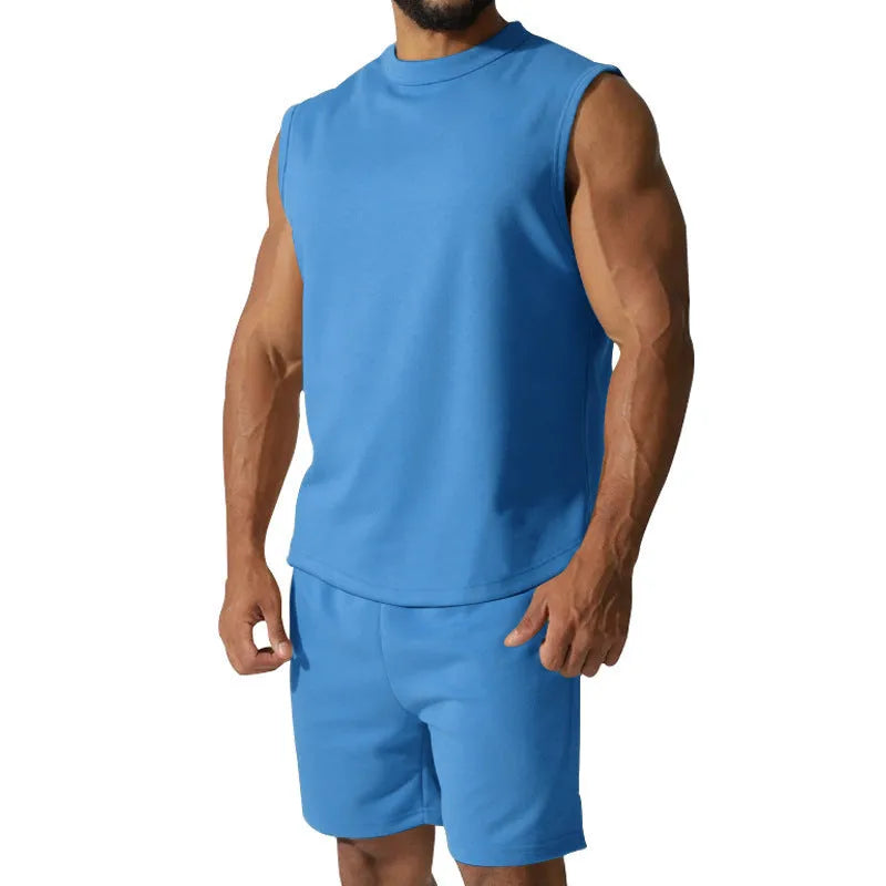 Men's sleeveless cotton blend sports suit showing sleeveless top and matching shorts in a solid colour.