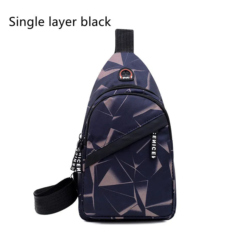 Men's blue Oxford cloth crossbody sling bag showing earphone hole and front zipper.