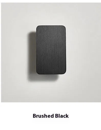Slim minimalist Nordic-style LED wall lamp mounted on a wall, shown in a choice of colours and sizes.