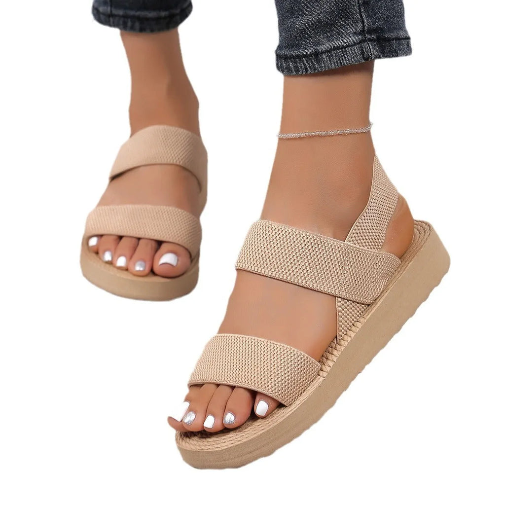 Women's flat wedge beach sandals with elastic band upper and EVA sole in median brown colour