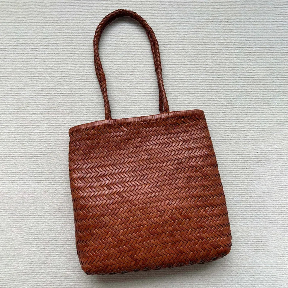 Brown woven tote shoulder bag with three-dimensional pocket made from first layer cowhide leather