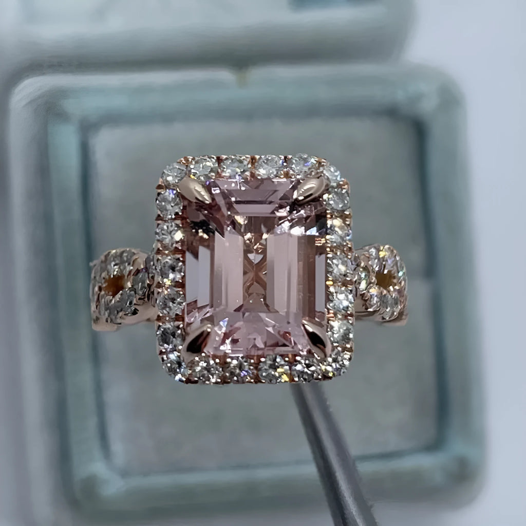 A geometric-shaped rose gold alloy ring on a plain background.