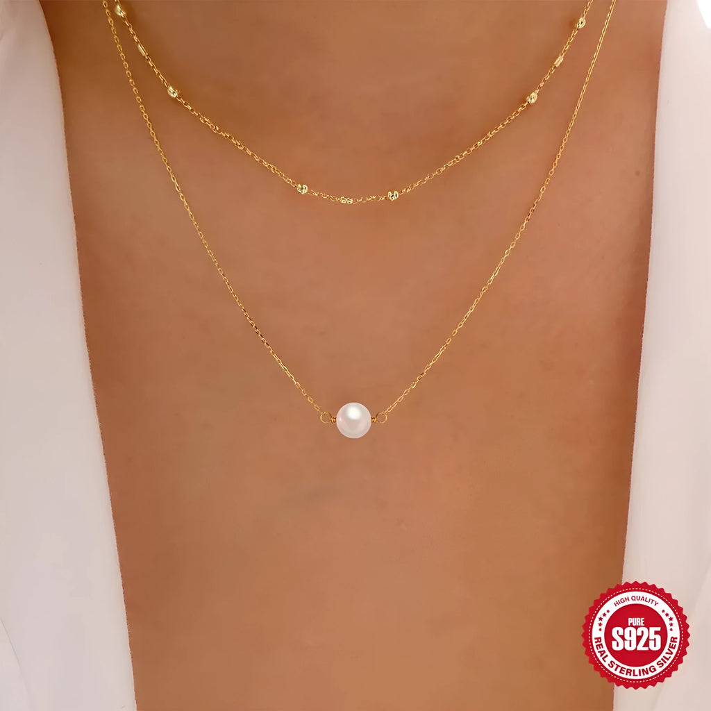 S925 sterling silver double layer necklace with twin geometric pearls in gold or white gold plating.