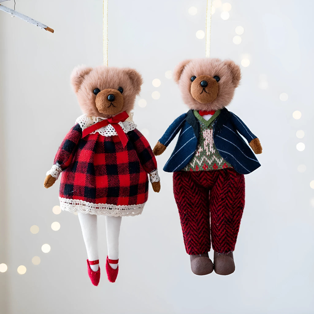Pair of plush bear dolls wearing red and black plaid cotton clothing, cartoon style.