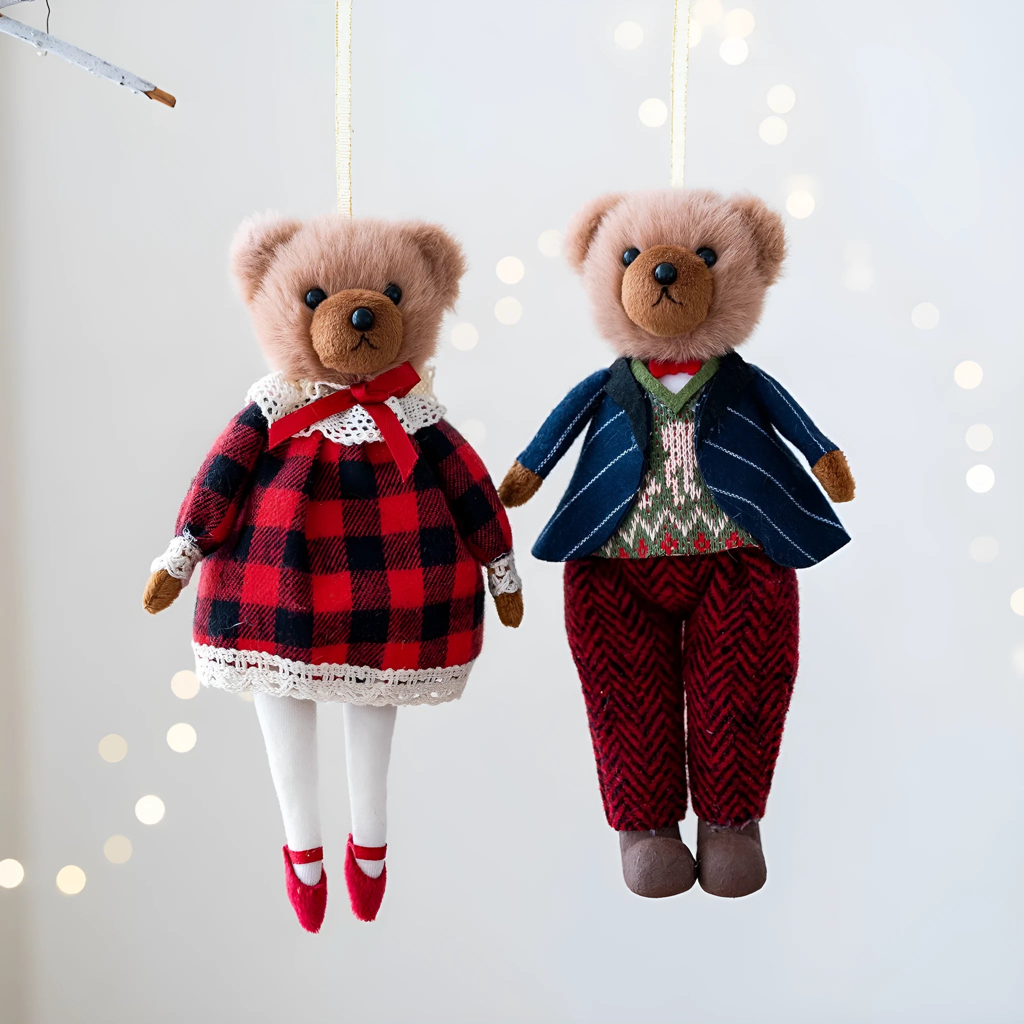 Pair of plush bear dolls wearing red and black plaid cotton clothing, cartoon style.