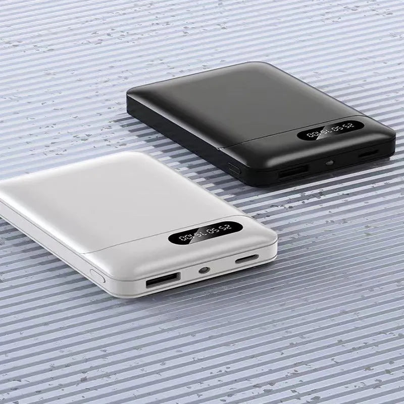 White or black portable power bank with multiple USB ports, showing compact 92mm x 63mm size.