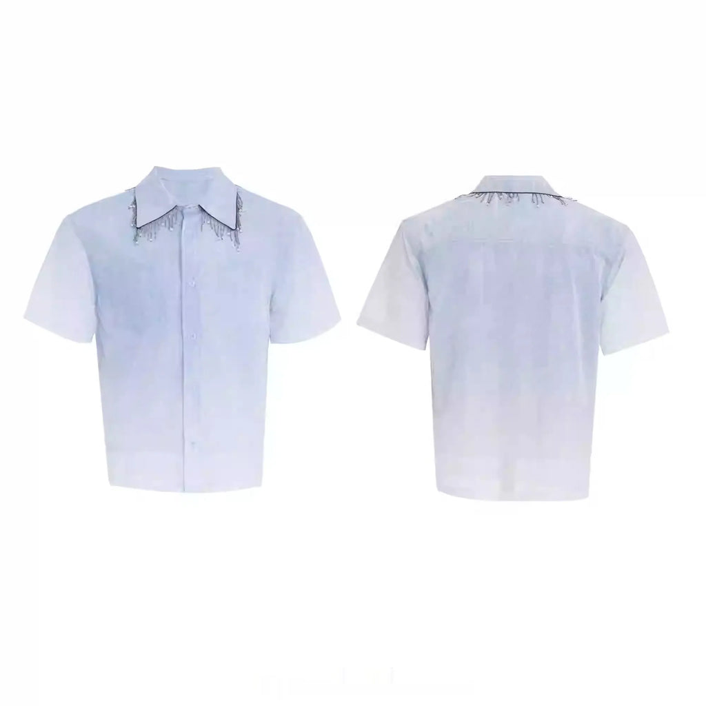 A loose-fit blue men's short sleeve shirt with a white gradient fade.