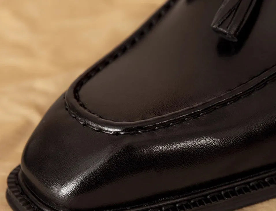 Men's black genuine leather loafers with fringed British styling and slip-on design