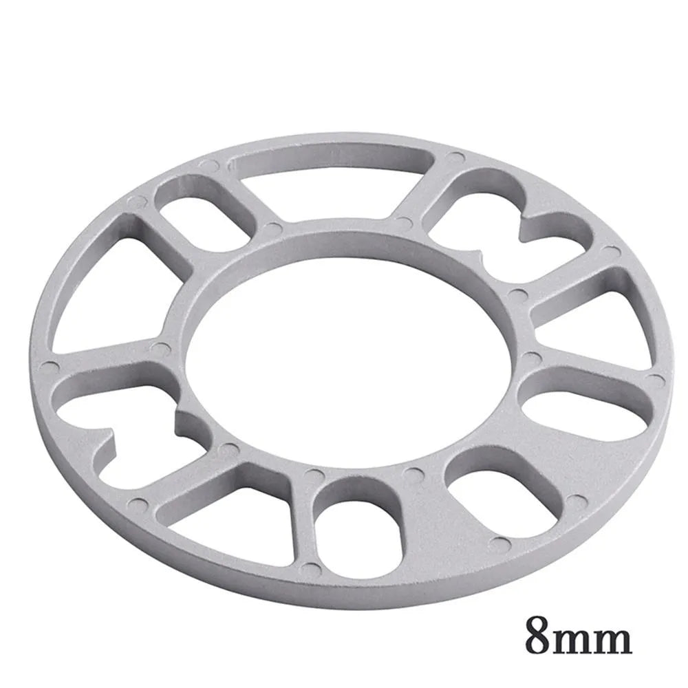 A single, circular metal automotive wheel hub spacer gasket for modifying wheel offset and brake clearance.