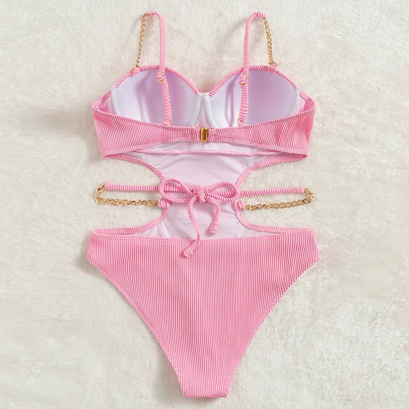 Ladies one piece solid colour swimsuit with chest pad, available in black and pink, sizes S M L