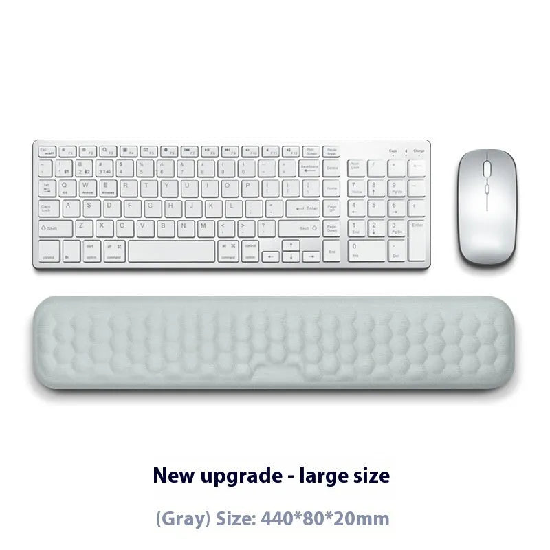 Grey and black memory foam mouse wrist pads with silicone bases, shown in cloth and leather cover options.