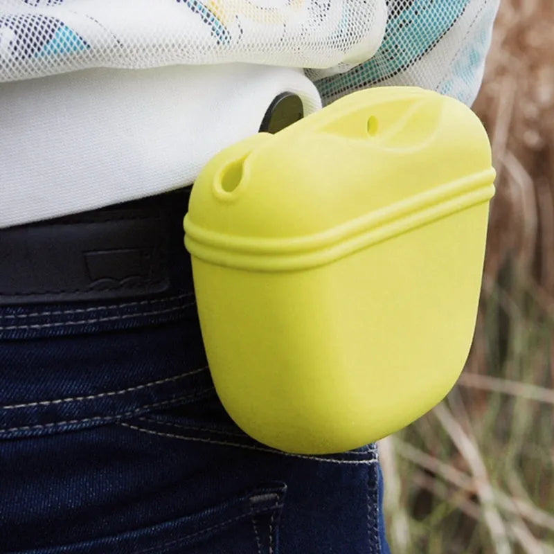 A silicone dog training treat pouch with a clip and magnetic closure, shown in one of six colour options.