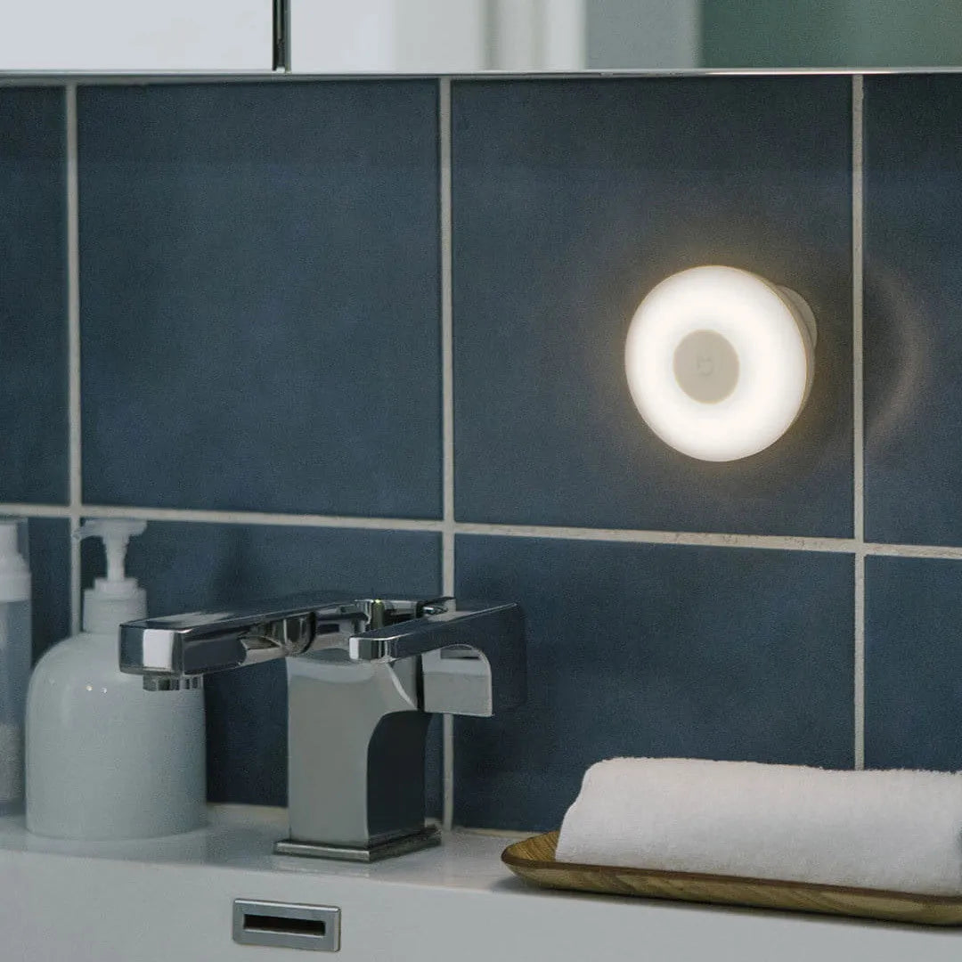 White modern Mijia Night Light 2 Bluetooth bedside lamp with motion sensor on a table.