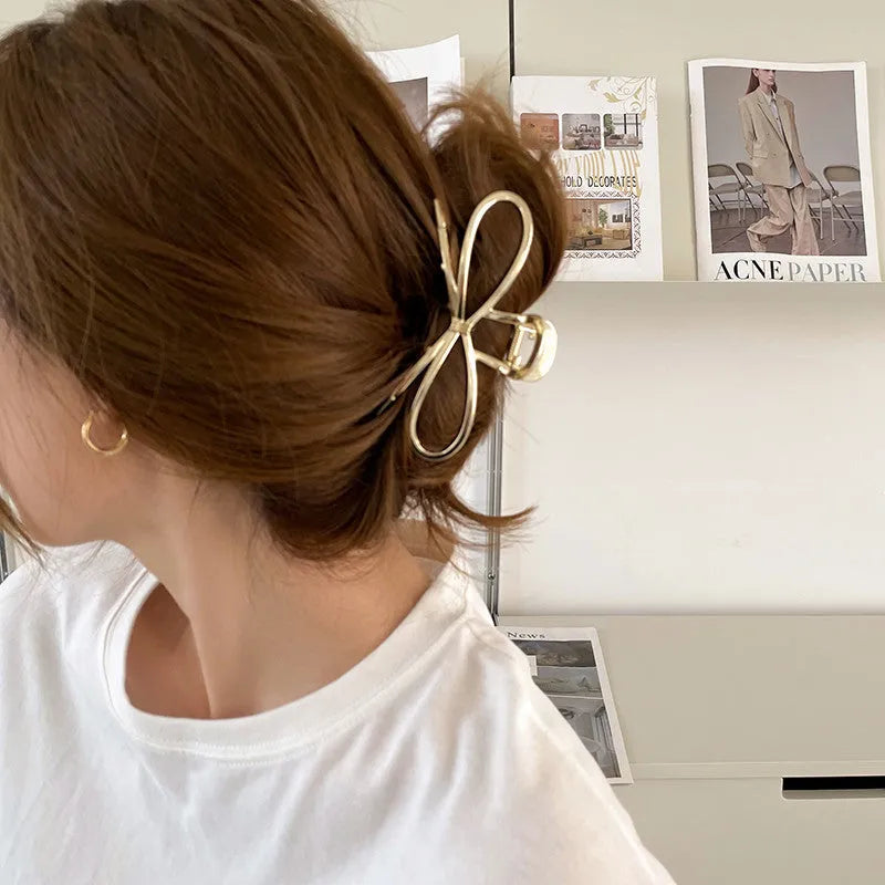 Korean style bow barrettes for women in gold and silver alloy metal with secure back head grip