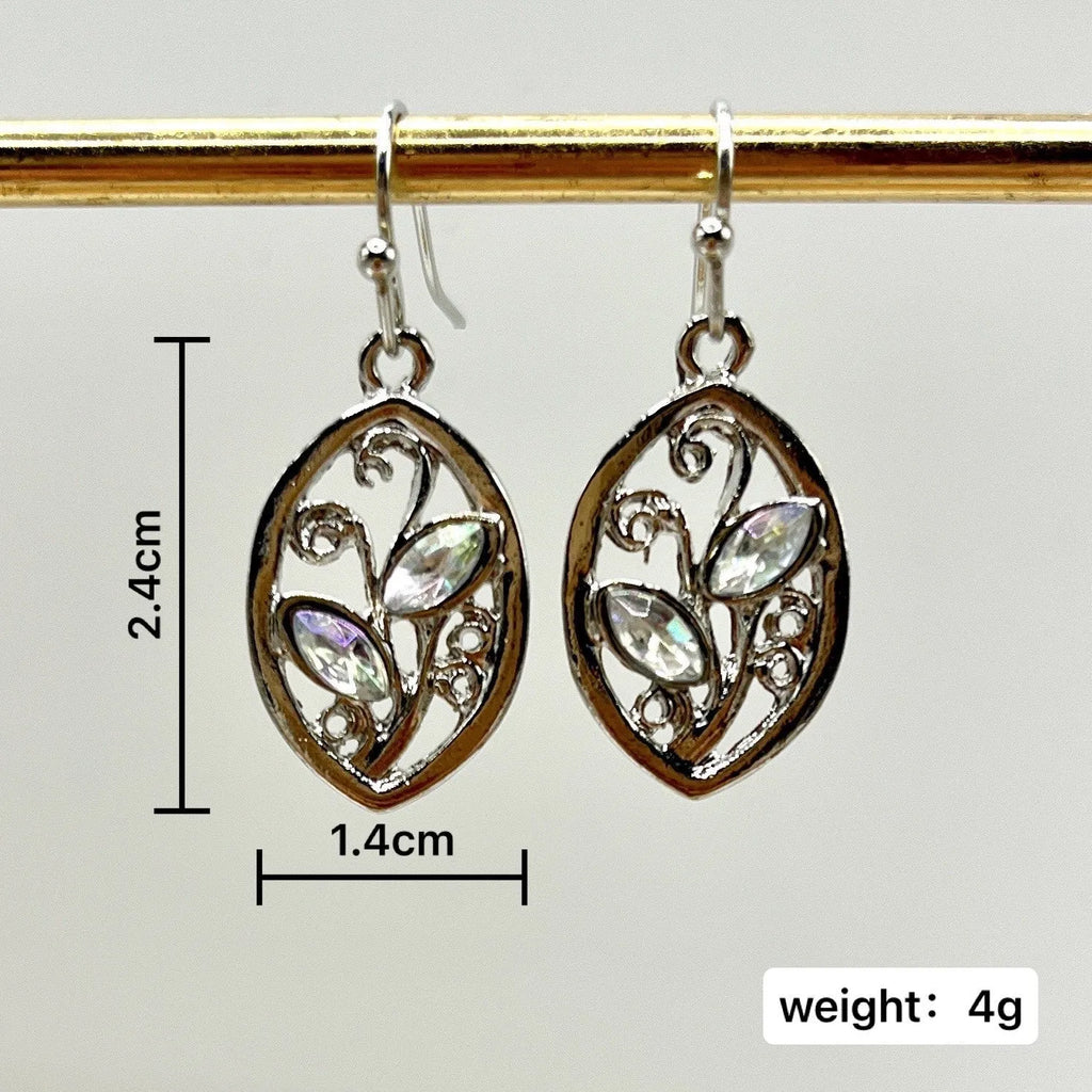Silver-coloured alloy earrings shaped like a leaf with colourful moonstone stones embedded in the design.