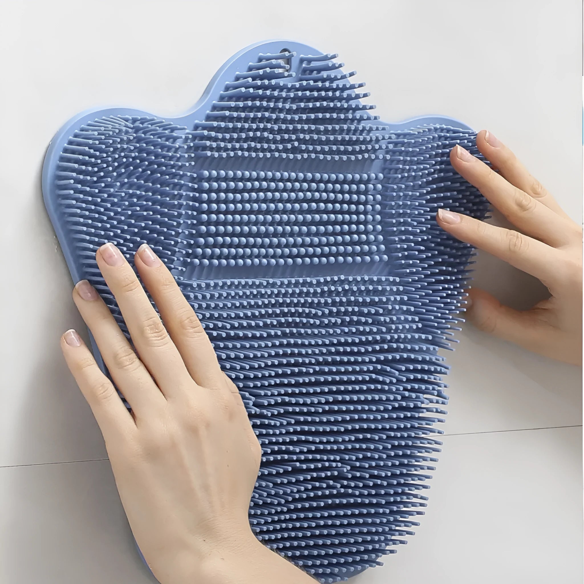 Blue silicone bath massage cushion mat for handheld back scrubbing, measuring 31cm by 32cm.