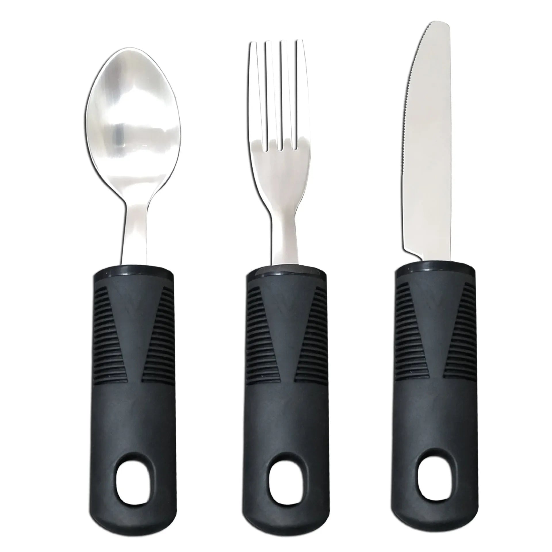 Stainless steel adaptive knife, fork, and spoon set with black rubber handles on a table.