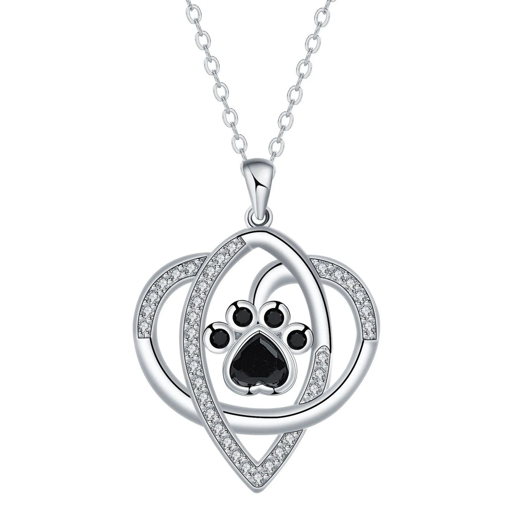 Copper necklace for women showing a pendant with dog paw and cat footprints design on a cross chain.