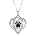 Copper necklace for women showing a pendant with dog paw and cat footprints design on a cross chain.