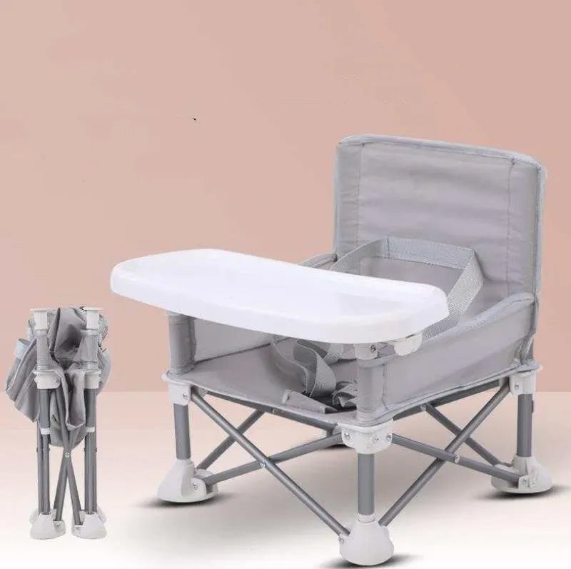 Foldable baby dining chair with metal frame, removable tray, and safety belt in grey