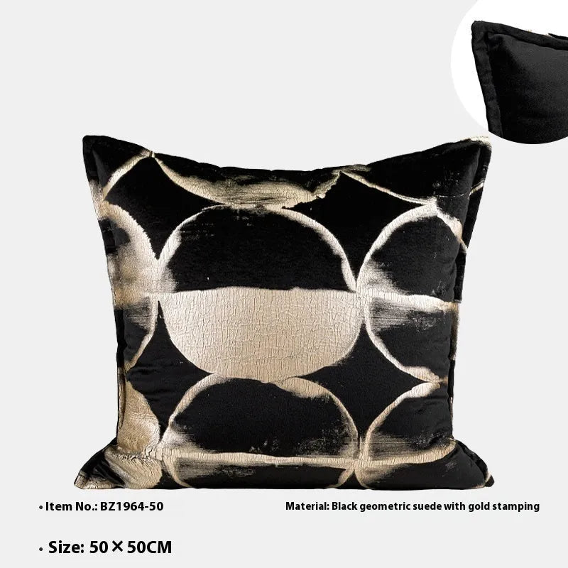 Black gold abstract pattern flannel cushion pillow in square and rectangular sizes on a sofa.
