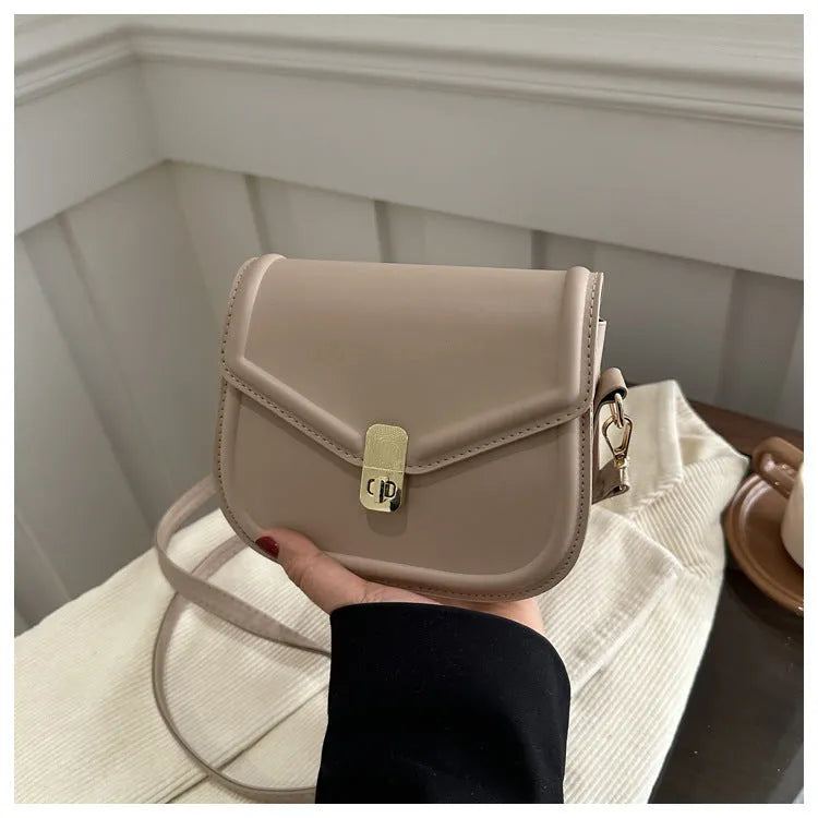 Niche texture shoulder messenger bag in soft PU leather with clamshell opening and horizontal square shape