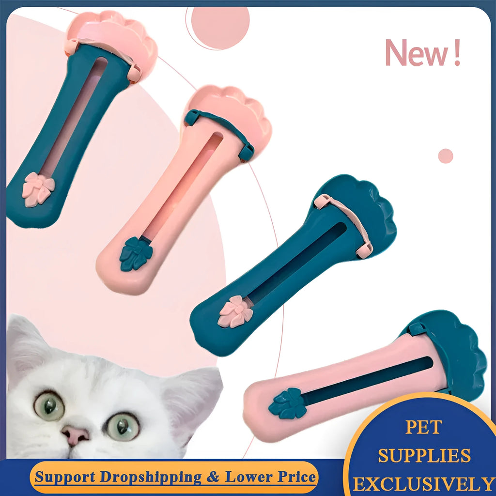 Green and pink pet food squeezer feeder with attached spoon for dispensing liquid and dry food