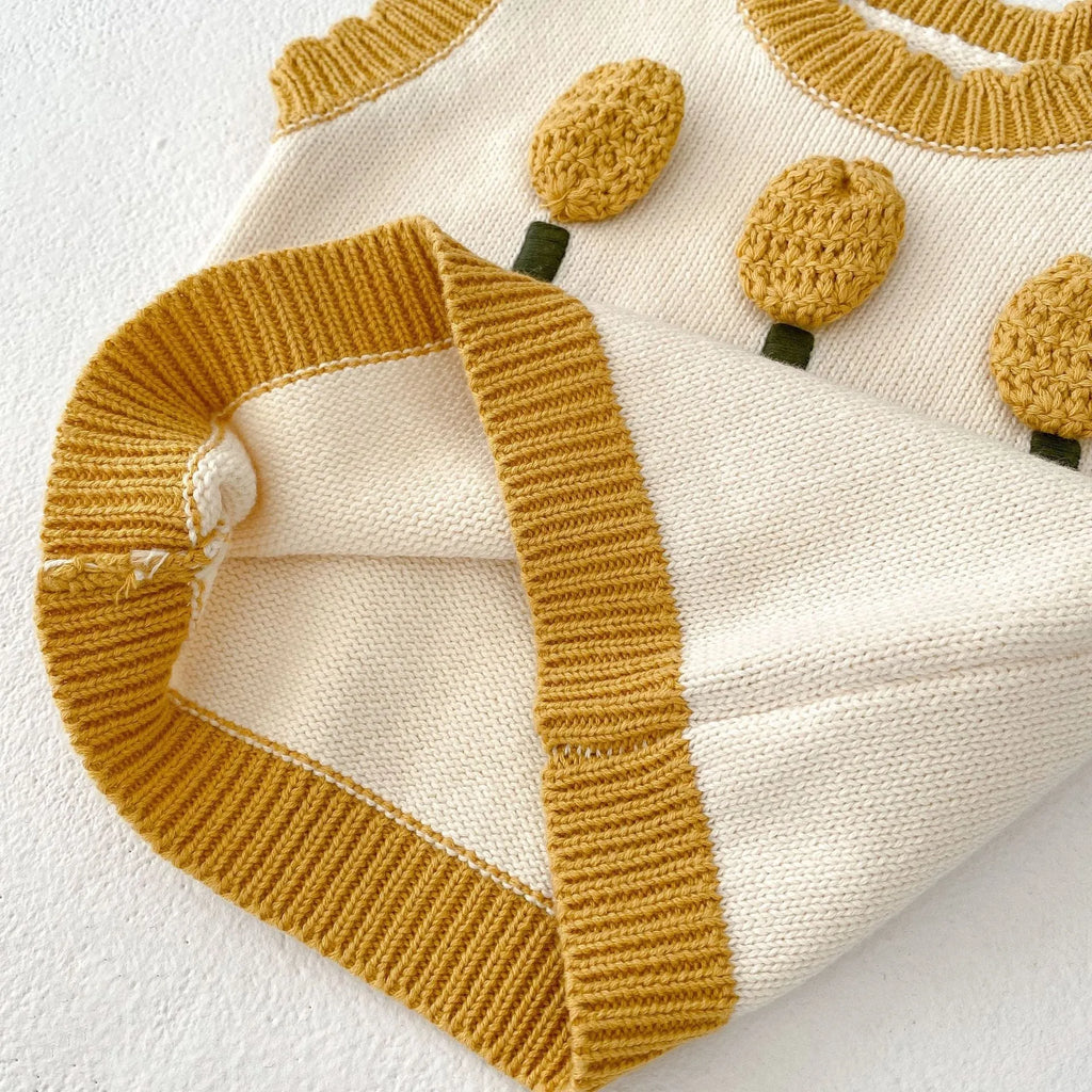 Baby girl sleeveless knitted cotton top with three-dimensional flower in almond white