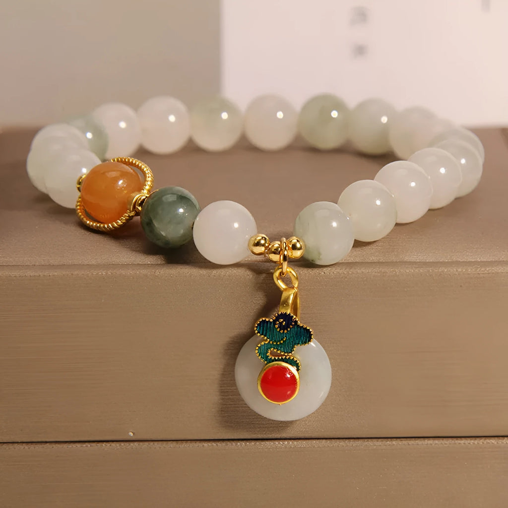 Women's jade crystal bracelet with ice jade colour, pearl accents, and peace jade buckle