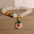 Women's jade crystal bracelet with ice jade colour, pearl accents, and peace jade buckle