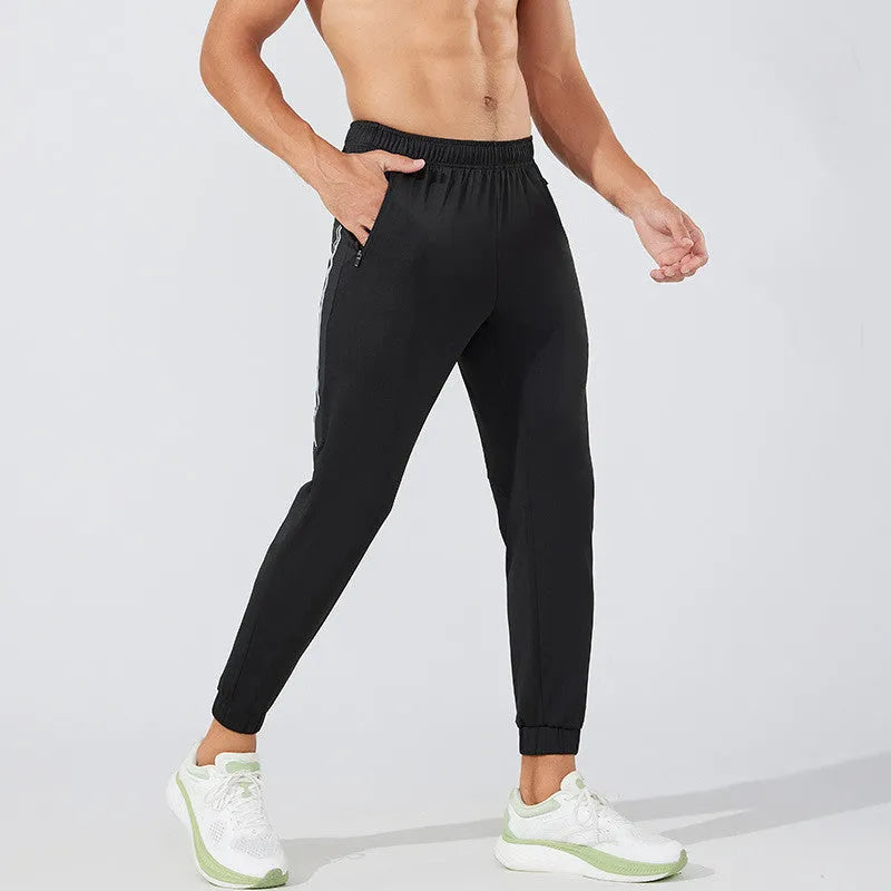 Men's black running trousers with mid waist fit and full length design for sports activities