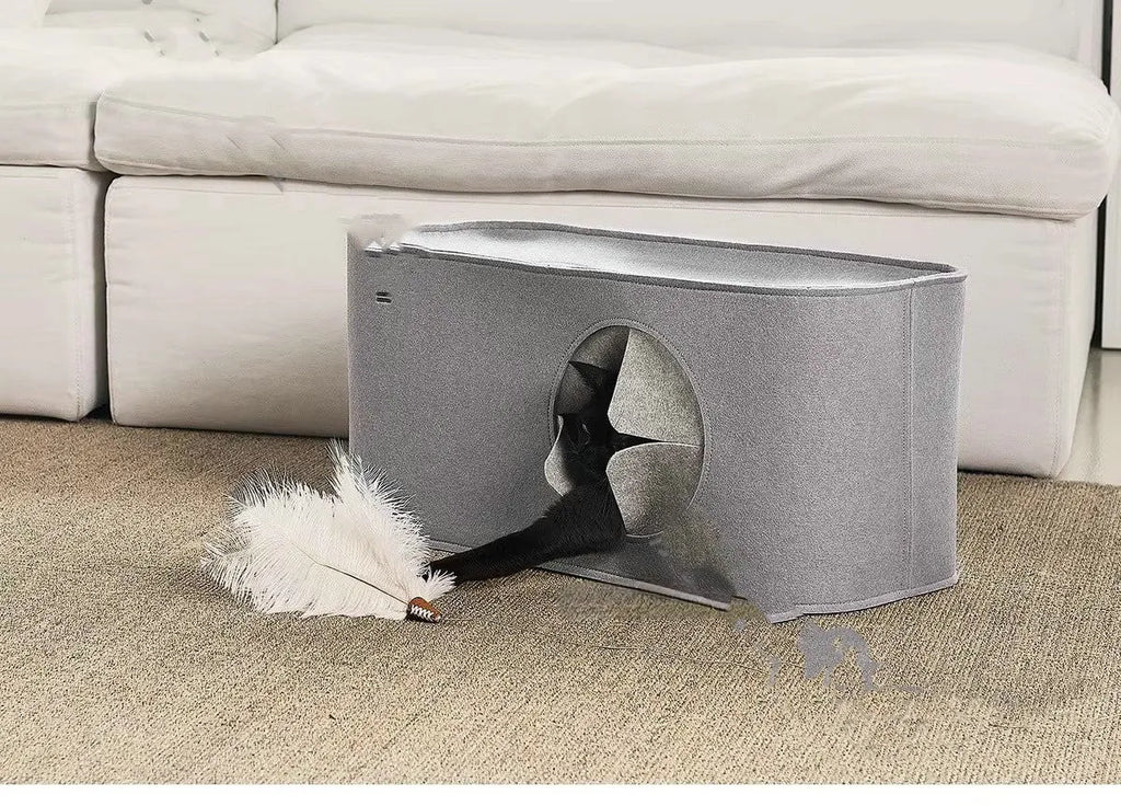 Grey foldable felt cat nest bed showing its size next to a cat.